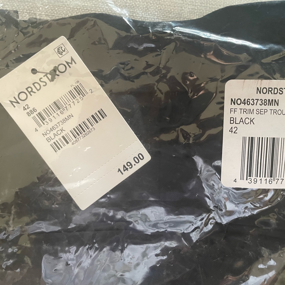 Men’s slacks, brand new in packaging.